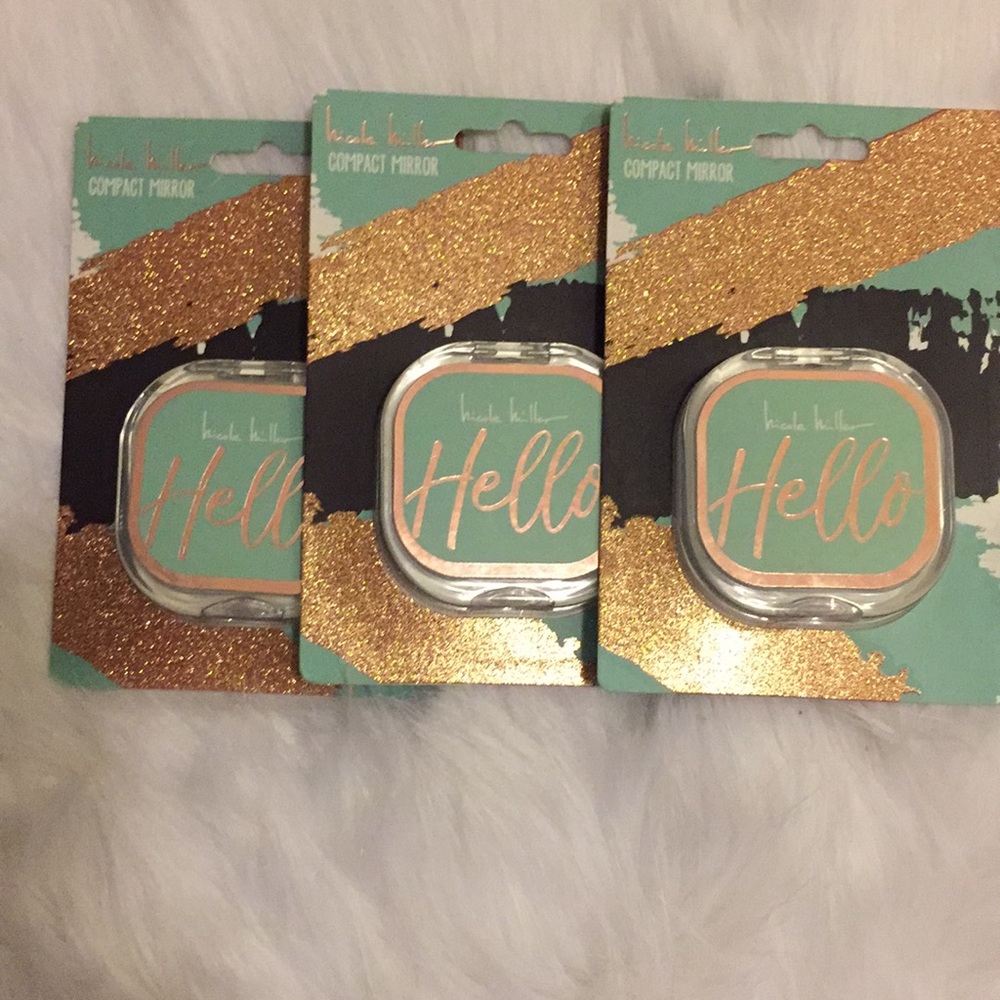 Nicole Miller compact mirrors.